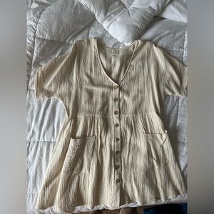 It’s cotton pocketed button down babydoll dress